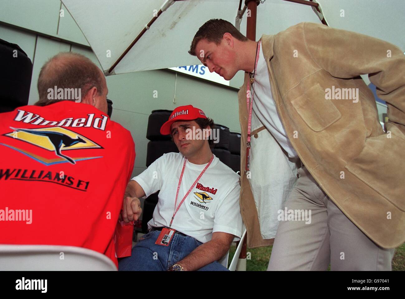 Formula One Motor Racing - Australian Grand Prix - Practice. New Williams drivers Alex Zanardi (C) & Ralf Schumacher chat to there race engineer Stock Photo