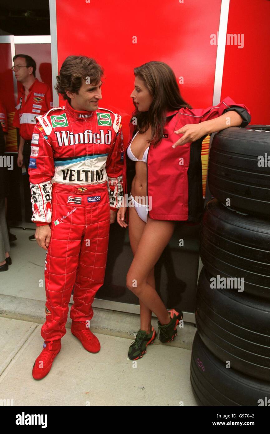 Formula One Motor Racing - Australian Grand Prix - Practice. Alex Zanardi talks to model Jodhi Meares Stock Photo