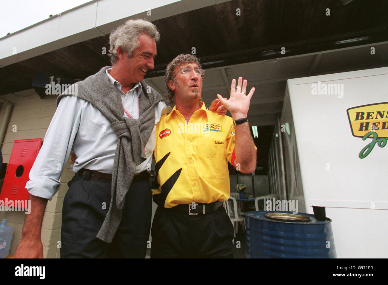 Eddie Jordan catches up with former Benetton Boss Flavio Briatore in the  paddock Stock Photo - Alamy