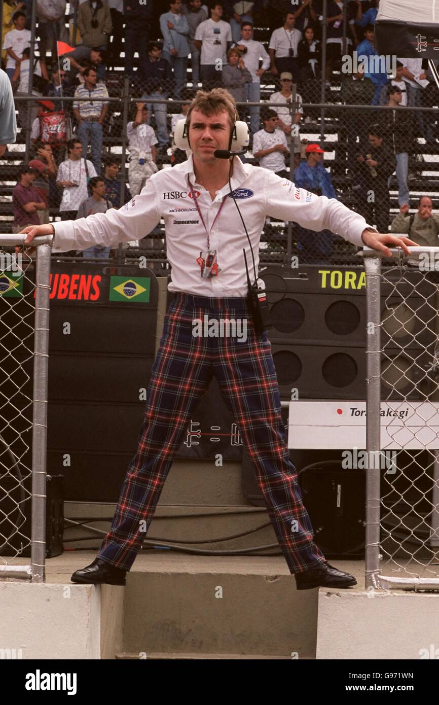 Stewart grand prix managing director stands on the pit wall hires