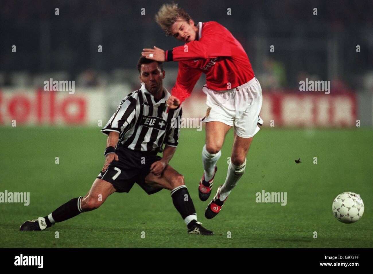 Soccer - UEFA Champions League - Semi Final 2nd Leg - Juventus v Manchester United. Manchester United's David Beckham is fouled by Juventus' Angelo Di Livio during the UEFA Champions League Match. Stock Photo