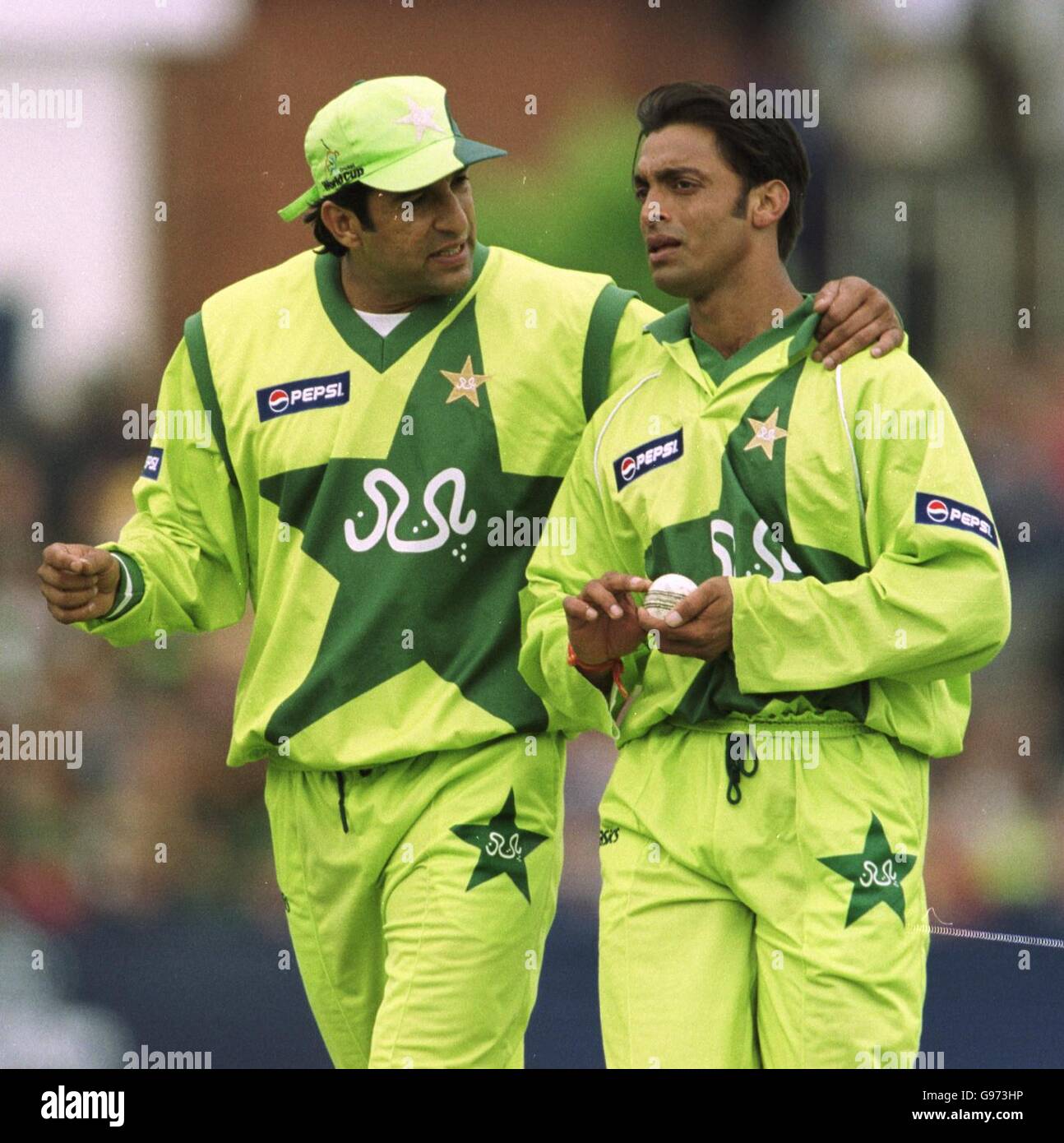 Cricket - ICC World Cup - Group B - Australia v Pakistan. Pakistans' captain Wasim Akram (l) cools a hot headed Shoaib Akhtar after he was warned by the umpire Stock Photo