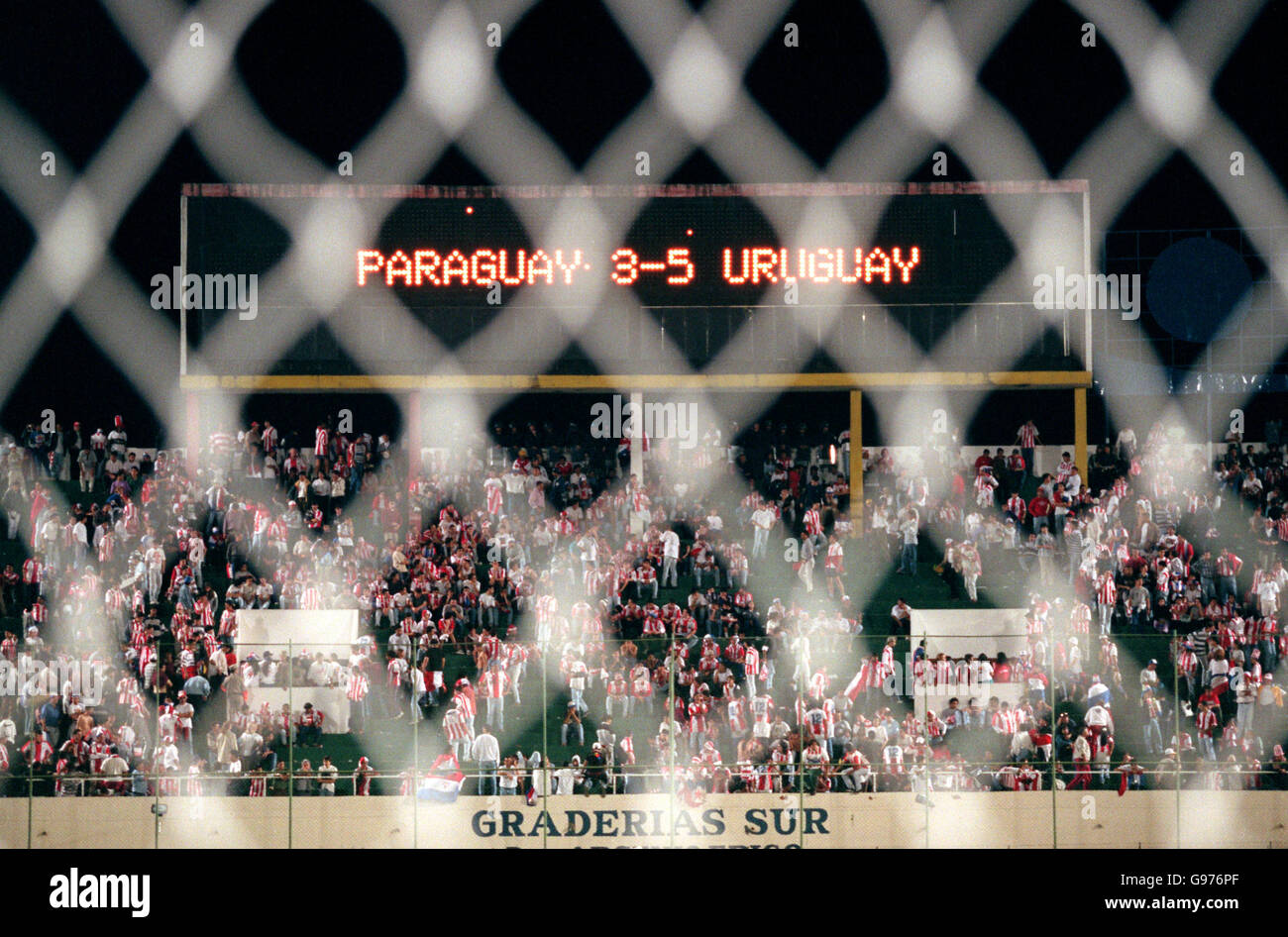 A view of the scoreboard through the goal net, after the penalty shoot out in which host nation Paraguay were knocked out of the Copa America to Uruaguay Stock Photo