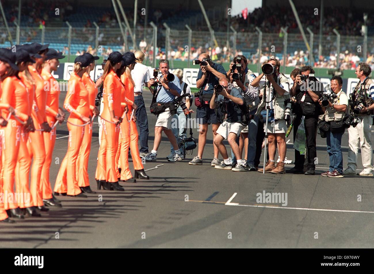 Formula One Motor Racing - British Grand Prix. Photographers take pictures of the pit girls Stock Photo
