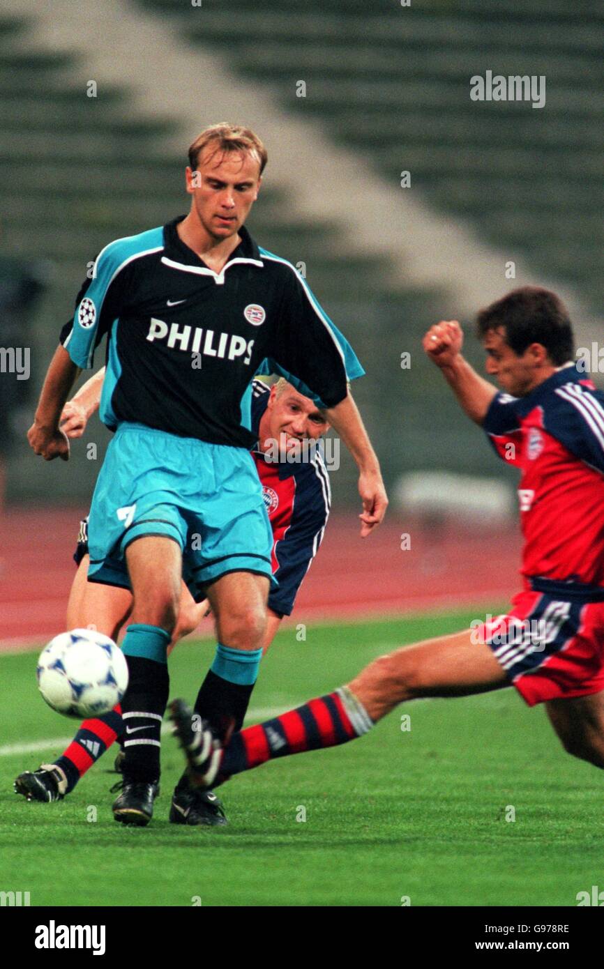 Soccer - UEFA Champions League - Group F - Bayern Munich v PSV Eindhoven. L-R, Dmitri Khokhlov of PSV Eindhoven is tackled by Bayern Munich's Mehmet Scholl Stock Photo