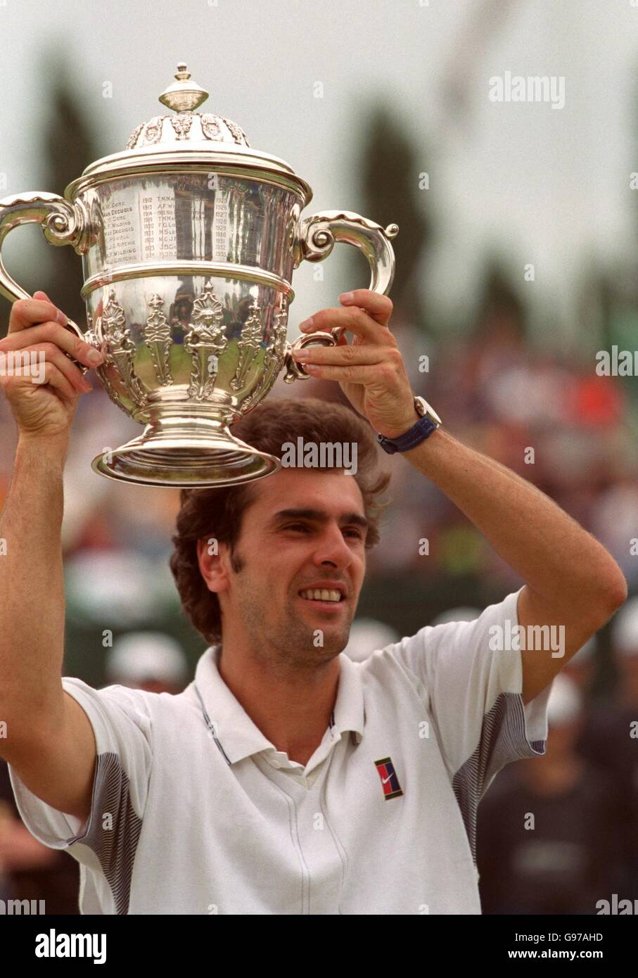 Cedric Pioline of France lifts the victory trophy at Nottingham after winning the final in straight sets. Stock Photo