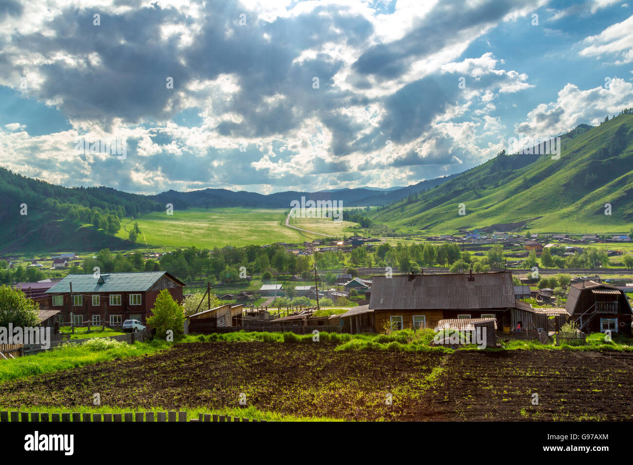 A small village in a mountain valley at the foot of the Altai Mountains ...