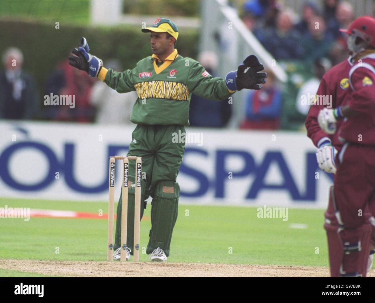 Bangladesh wicketkeeper Khaled Masud seems to be practising his umpiring Stock Photo