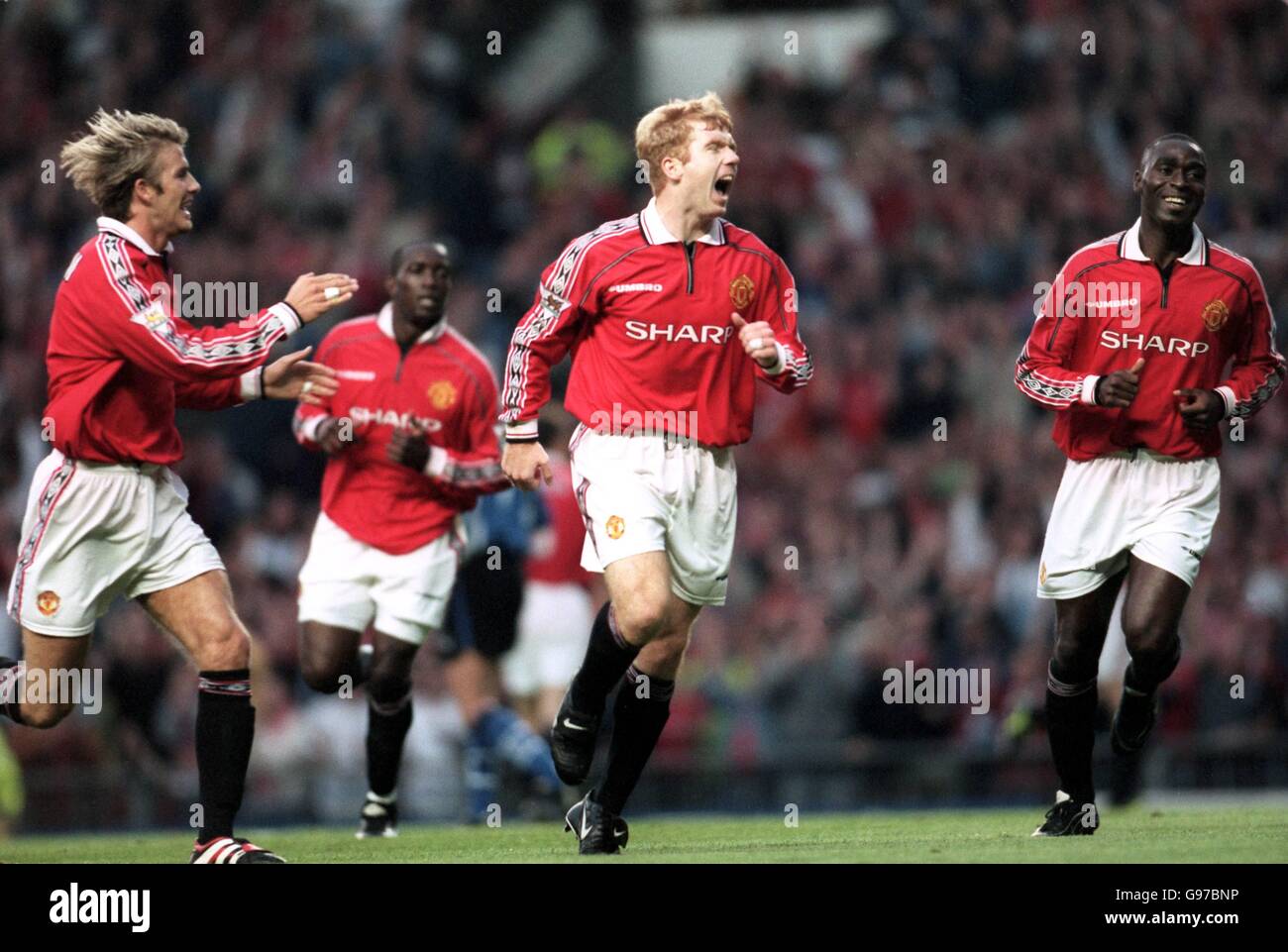 Soccer - FA Carling Premiership - Manchester United v Sheffield Wednesday. Manchester United's Paul Scholes celebrates his goal with David Beckham and Andy Cole against Sheffield Wednesday Stock Photo