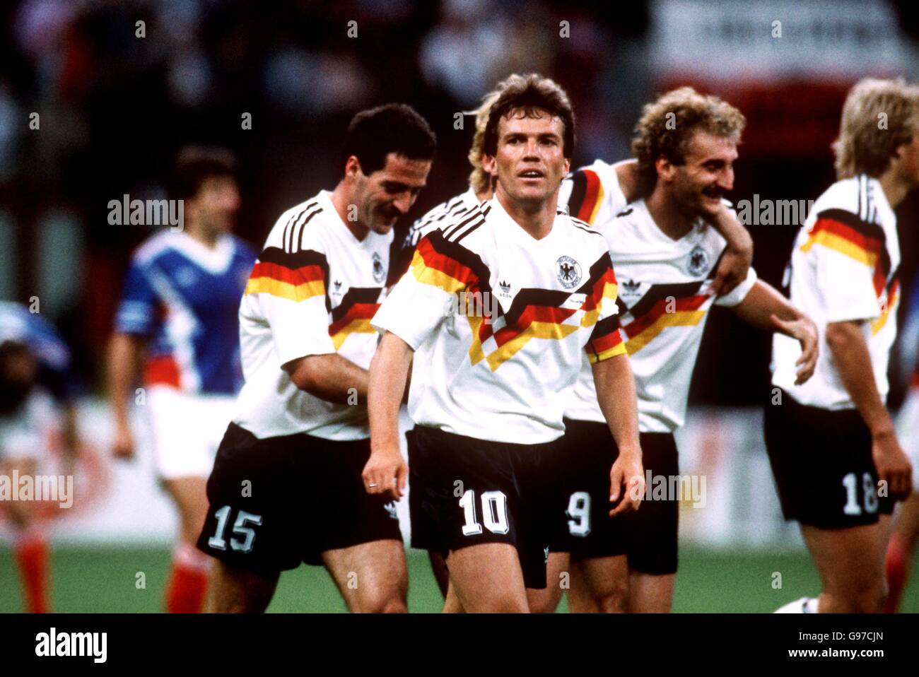 West Germany's Lothar Matthaus (centre) is congratulated after scoring his team's third goal Stock Photo