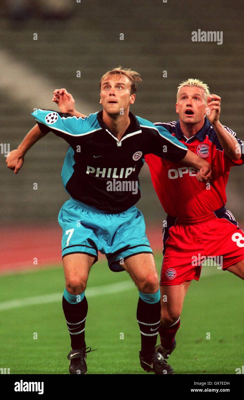 Thomas Strunz of Bayern Munich and Dmitri Khokhlov of PSV Eindhoven competing in the air for the ball Stock Photo
