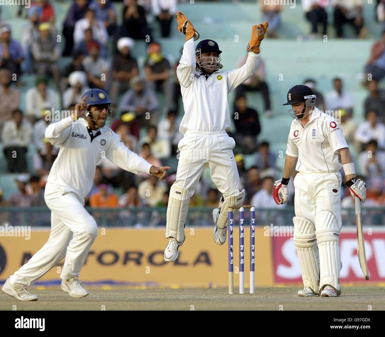 England's Ian Bell edges the ball to Indian wicketkeeper Mahendra Dhoni and is dismissed during the fourth day of the second Test match at the PCA Stadium, Mohali, India, Sunday March 12, 2006. PRESS ASSOCIATION Photo. Photo credit should read: Rebecca Naden/PA. Stock Photo