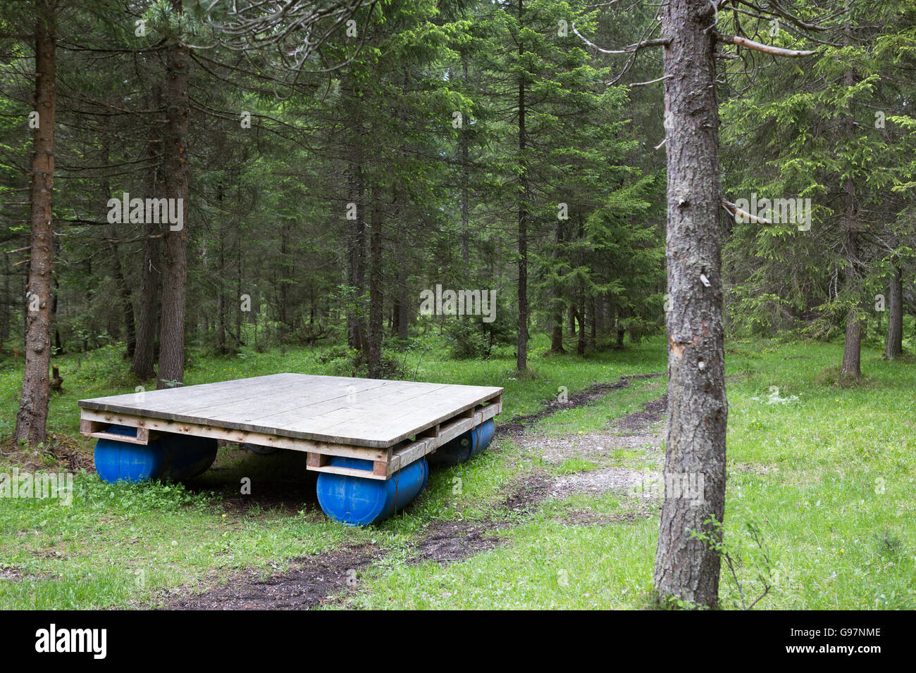 A raft abandoned in a forest Stock Photo