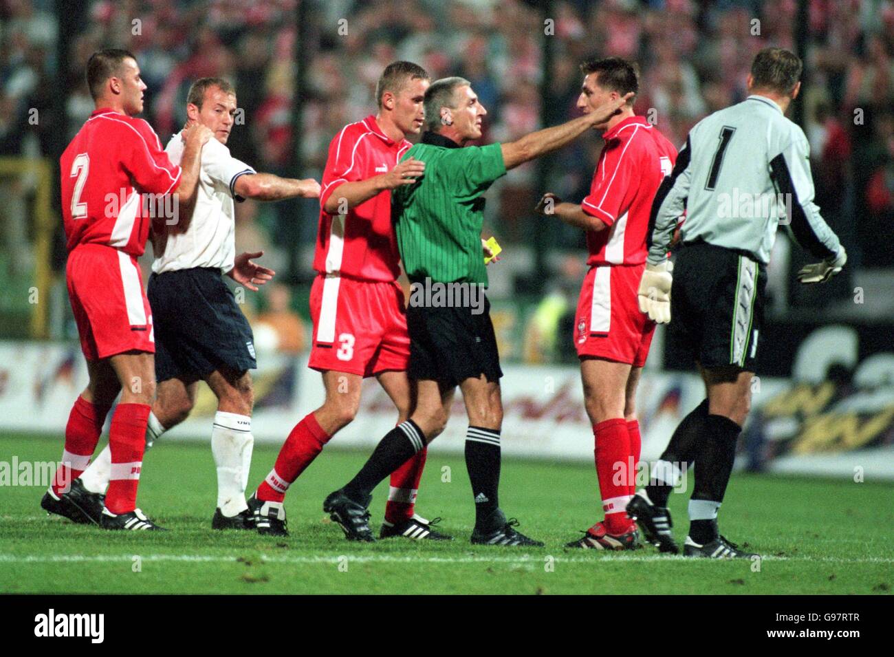 Soccer - Euro 2000 Qualifier - Group Five - Poland v England. England's Alan Shearer is held back from approaching the referee by Tomasz Klos Stock Photo