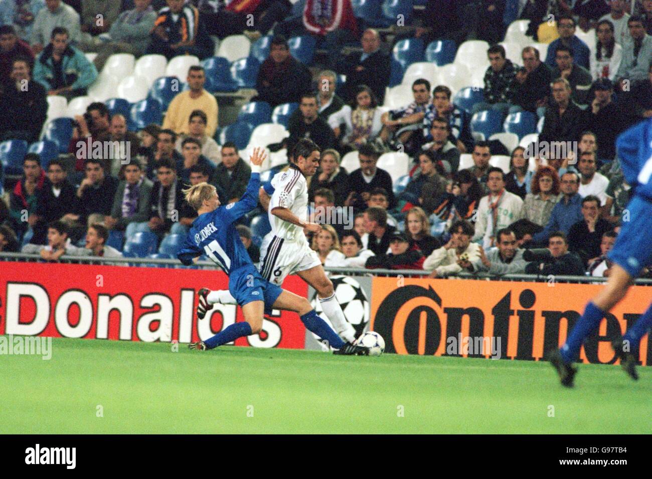 Molde's Andre Schei Lindbaek (left) slide tackles Real Madrid's Fernando Redondo (right) Stock Photo