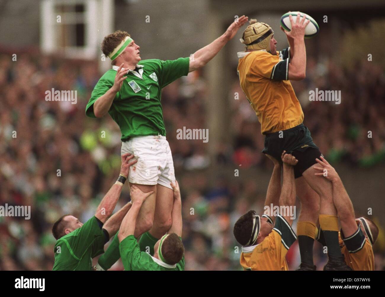 Rugby Union - Rugby World Cup 99 - Pool E - Ireland v Australia. Ireland's Malcolm O'Kelly leaps at a line-out with Australia's David Giffin Stock Photo