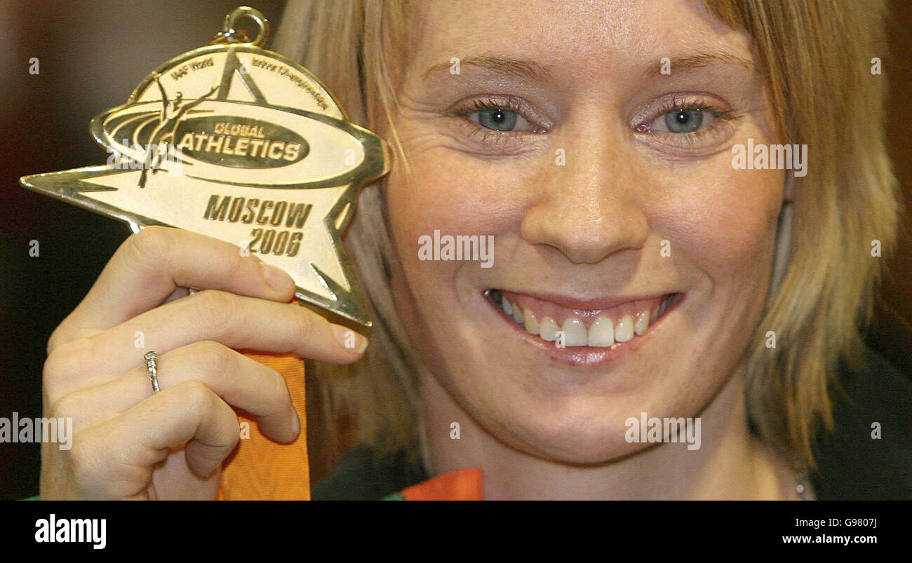 Gold Medal winning athlete Derval O'Rourke holds her medal at the arrival area of Dublin airport, Monday March 13, 2006, after the 24-year-old Leevale Athletics Club runner yesterday won the Women's 60 Metre Hurdles Final and set a new Irish record time for the event. See PA Story SPORT ORourke Ireland. PRESS ASSOCIATION Photo. Photo credit should read: Niall Carson/PA Stock Photo