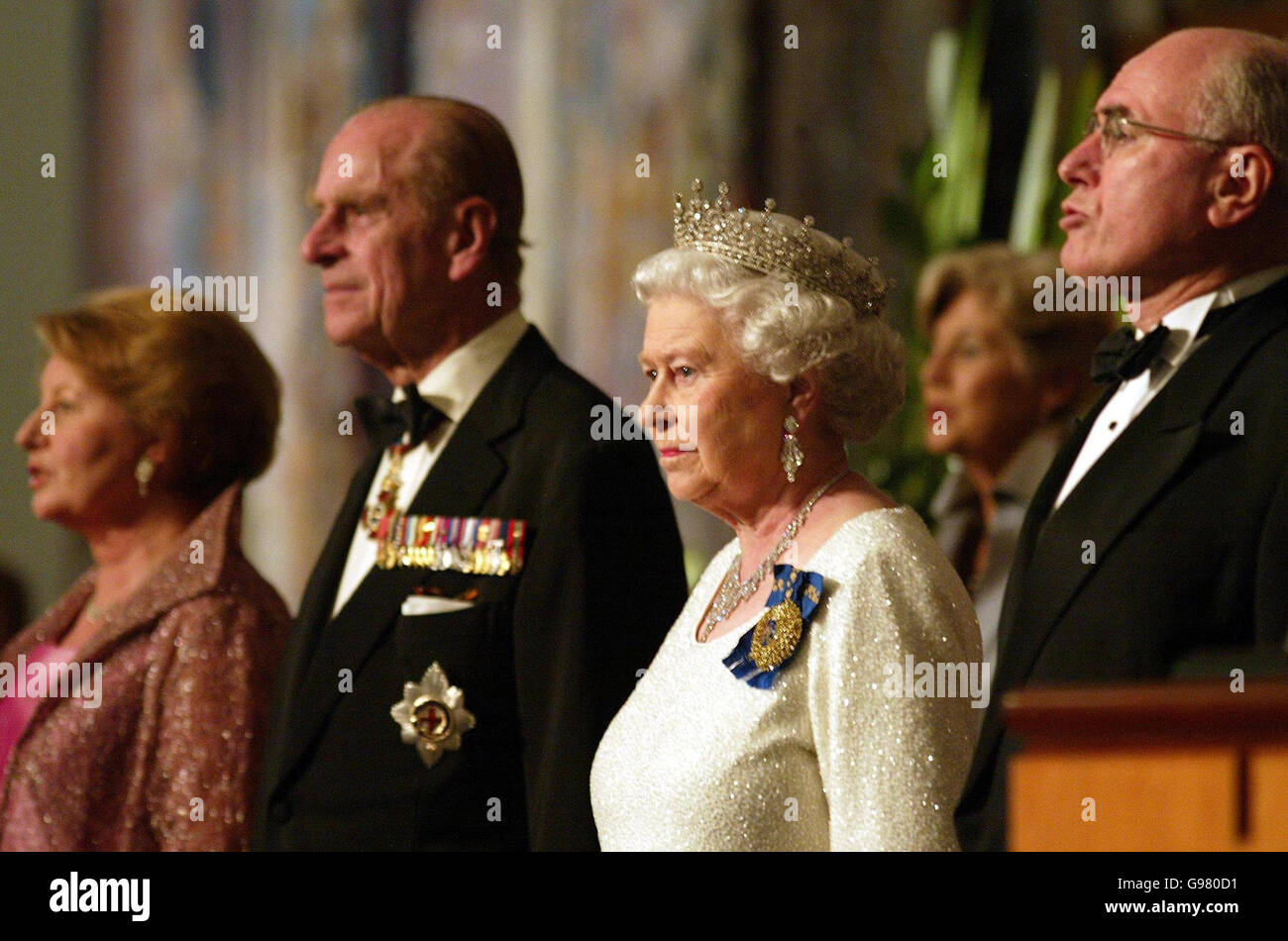 Queen Elizabeth II, the Duke of Edinburgh, Australian Prime Minister John Howard (right) and wife Marlena Howard (left) stand during an official dinner in Parliament House, Canberra, Australia, Tuesday March 14, 2006. The Queen is conducting a five-day tour of the country. See PA story ROYAL Queen. PRESS ASSOCIATION photo. Photo credit should read: Gareth Fuller/PA. Stock Photo