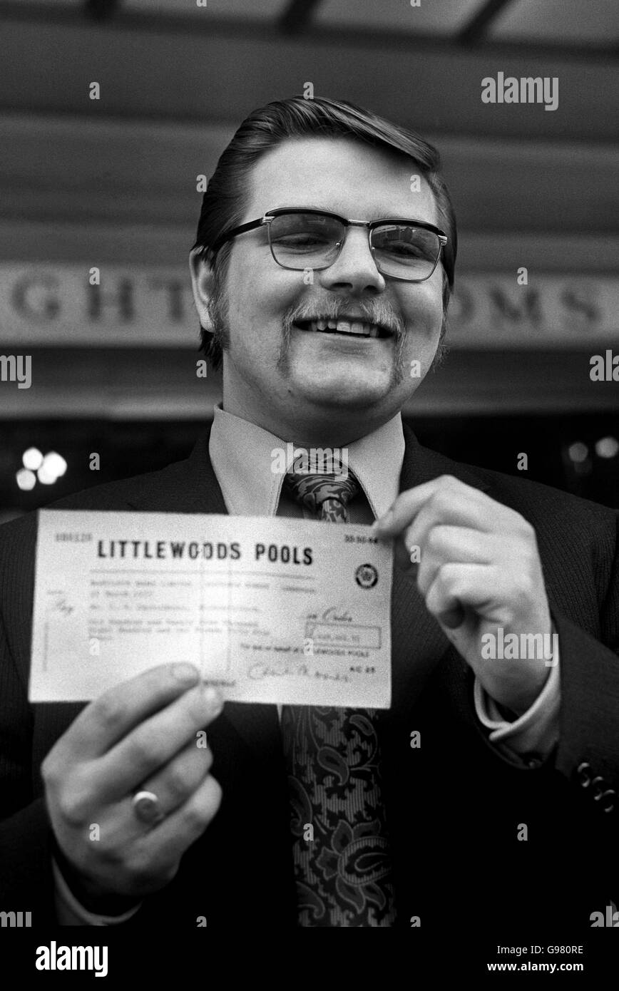 Winner of the world's biggest ever pools prize, Mr Colin Carruthers, 24, of Kirkintilloch, Dunbartonshire, shows his Littlewoods cheque for GBP 629,801. A bachelor who moved to Scotland two years ago from Gateshead, Co Durham, he is a motorcycle mechanic working for his uncle in Glasgow. Stock Photo