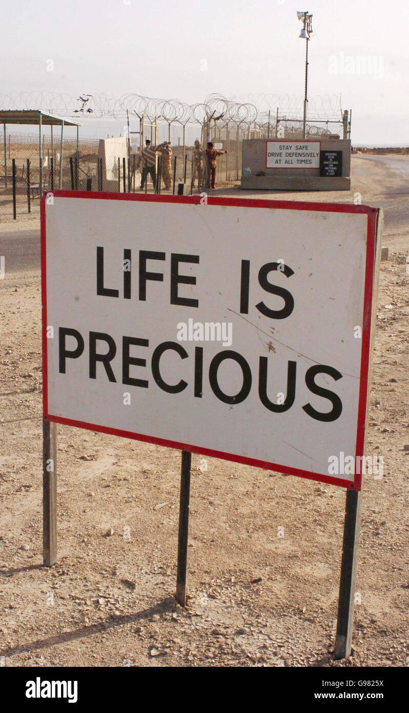 A sign proclaiming the slogan 'Life Is Precious' stands at the gates of Shaibah Logistics Base (SLB) near Basra, southern Iraq, Friday March 17, 2006. Around 1500 men are based at the SLB and lookout towers such and security gates which are based around the perimeter fencing are there to protect from intruders. See PA story DEFENCE Iraq. PRESS ASSOCIATION photo. Photo Credit should read : Johnny Green/PA. Stock Photo