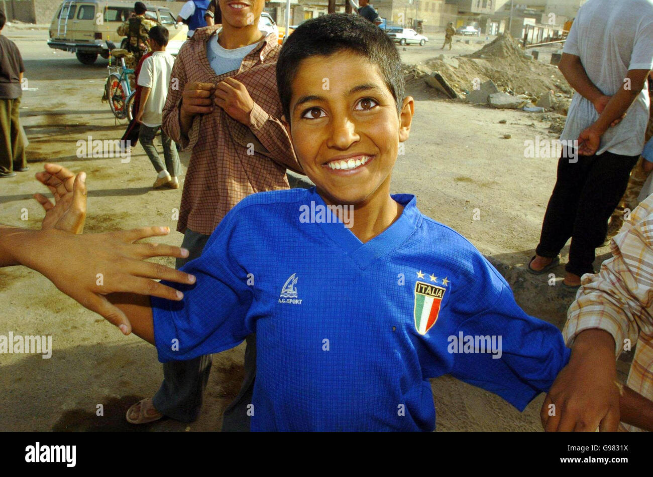 An Iraqi boy sports an Italian national football shirt on the outskirts of Az Zubayr, southern Iraq, Saturday March 18, 2006. As the third anniversary of the invasion of Iraq approaches, mixed sentiments of the ongoing presence of coaltion forces are still visible, with some openly welcoming while others are not. See PA story DEFENCE Iraq. PRESS ASSOCIATION photo. Photo Credit should read : Johnny Green/PA. Stock Photo