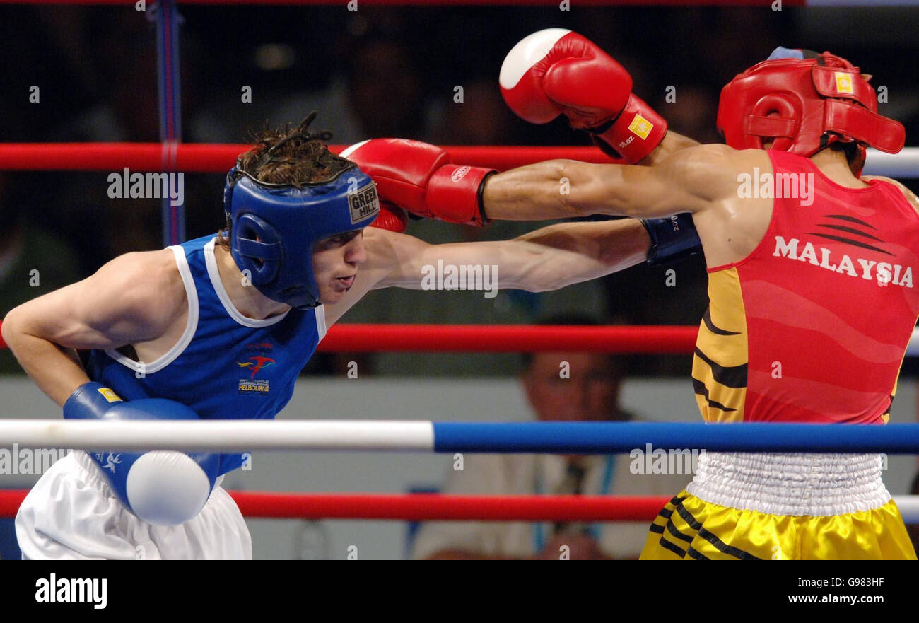 Wales' Darren Edwards (L) in action with Malaysia's Eddey Kalai during their Featherweight Quarterfinal fight at the Melbourne Exhibition Centre, during the 18th Commonwealth Games in Melbourne, Australia, Wednesday March 22, 2006. PRESS ASSOCIATION Photo. Photo credit should read: Sean Dempsey/PA. Stock Photo