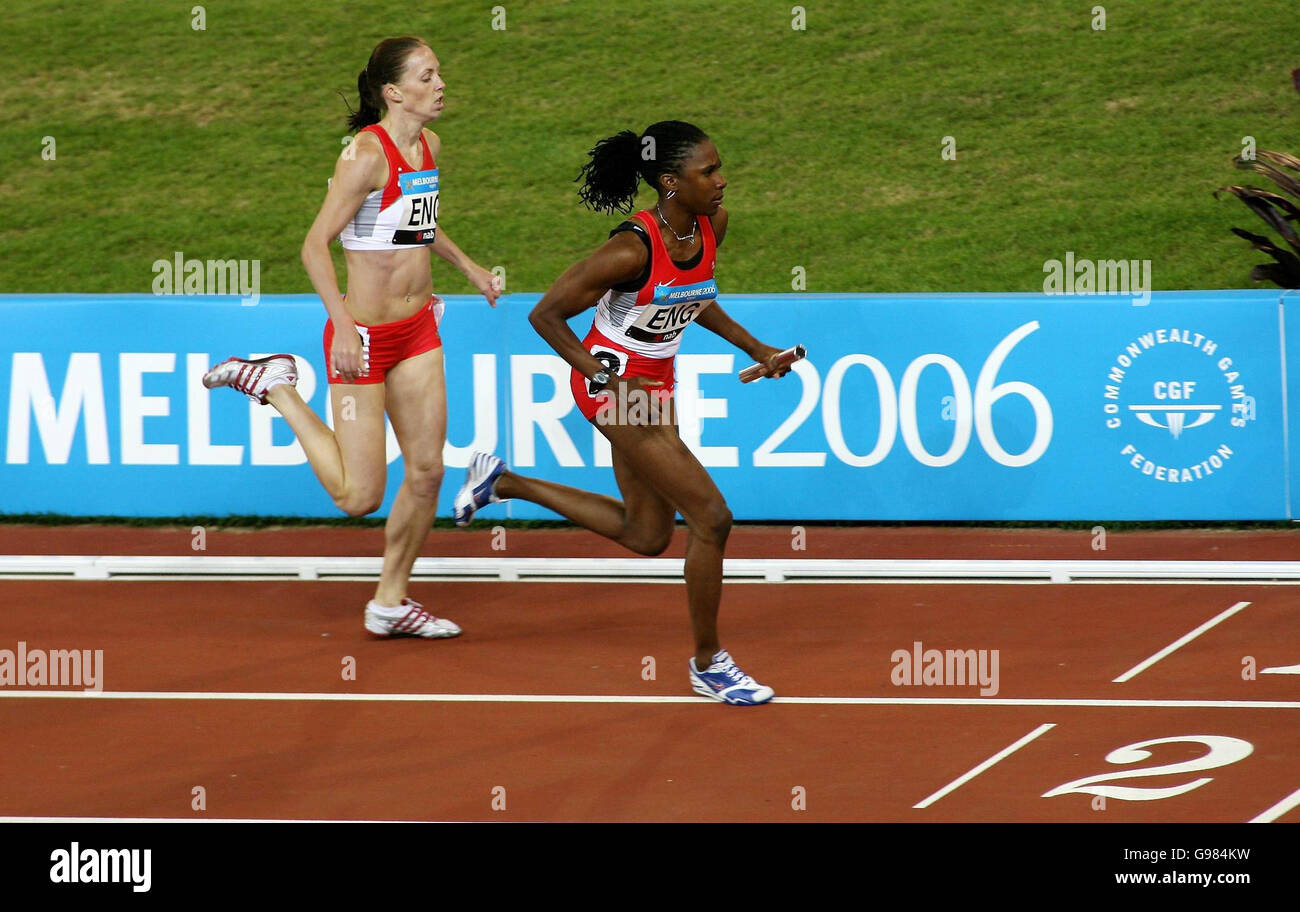 England's Nicola Sanders (L) hands the baton to Natasha Danvers to start the third leg of the Women's 4x400 metres relay final at Melbourne Cricket Ground, during the 18th Commonwealth Games in Melbourne, Australia, Saturday March 25, 2006. England's celebrations were cut short when it was announced they had been disqualified from the event with Danvers-Smith accused of blocking Tamsyn Lewis at the changeover for the third leg. PRESS ASSOCIATION Photo. Photo credit should read: Gareth Copley/PA. Stock Photo