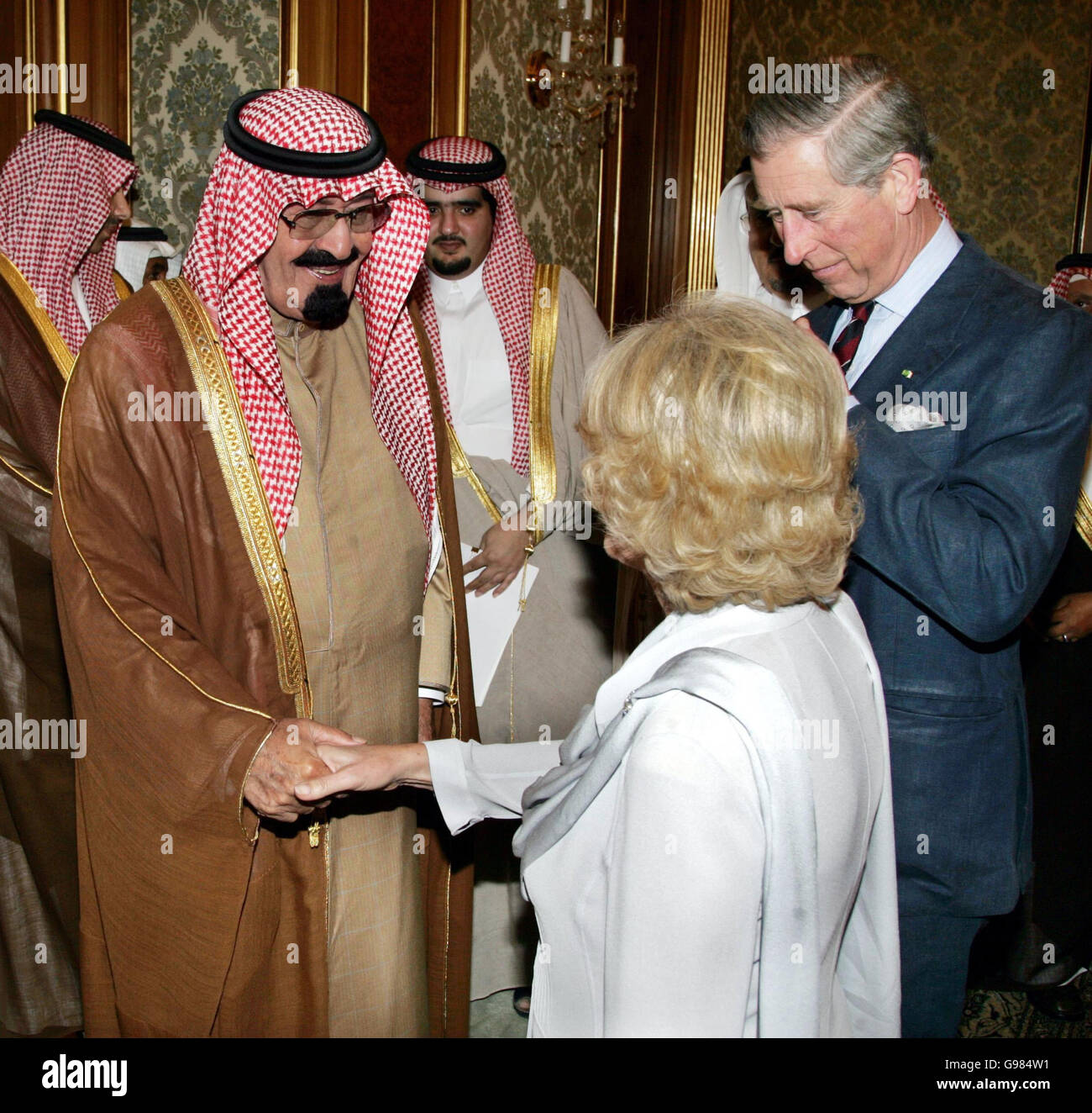 The Duchess of Cornwall shakes hands with King Abdullah Bin Abdulaziz, while the Prince of Wales looks on, Riyadh, Saudi Arabia, Saturday March 25, 2006. Prince Charles and Camilla are spending two days in Riyadh amid intense security as they continue with their second overseas tour. See PA story ROYAL Charles. PRESS ASSOCIATION photo. Photo credit should read: Ian Jones/Daily Telegraph Pool/PA Stock Photo