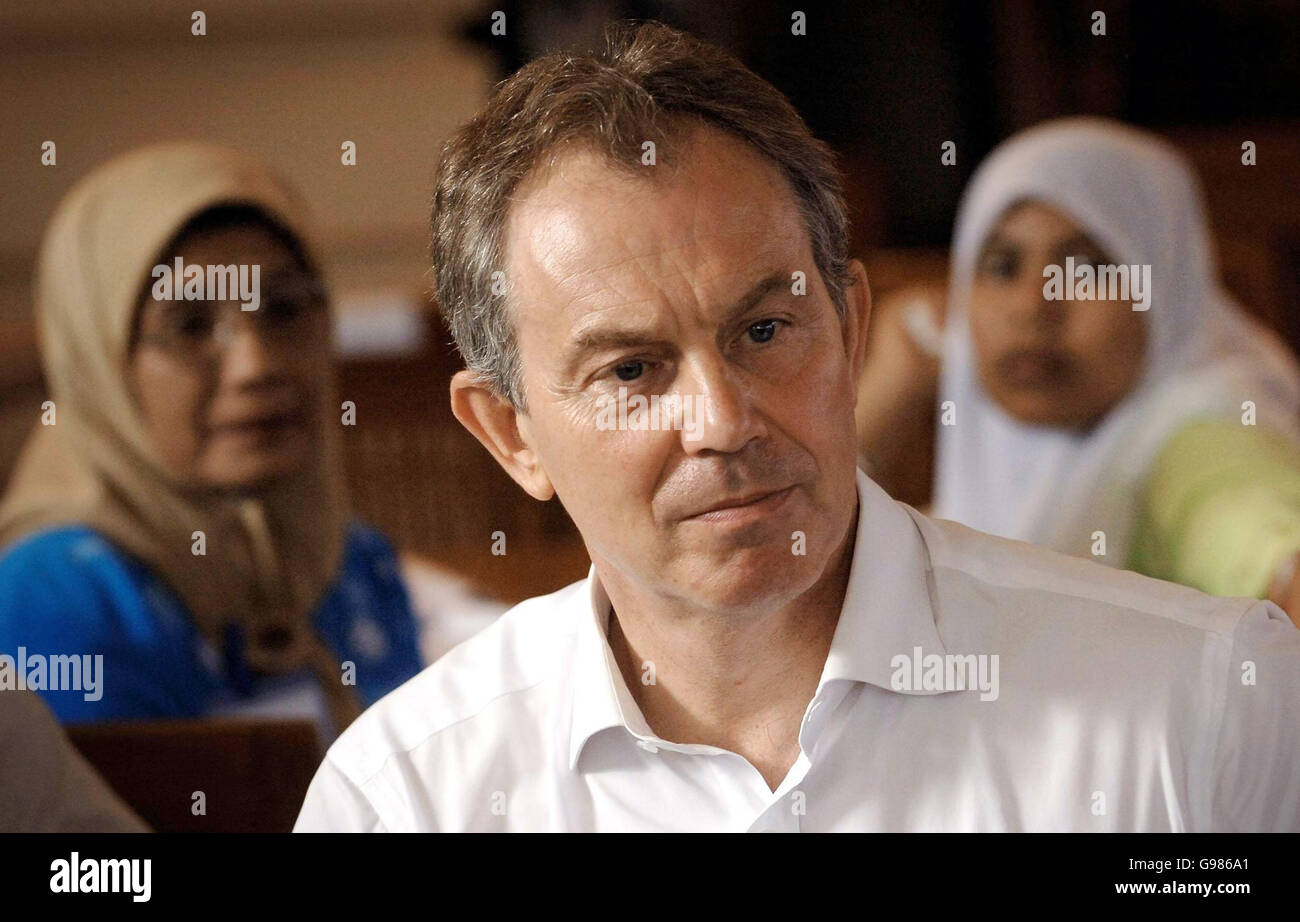 Britain's Prime Minister Tony Blair meets widows of the tsunami disaster and the civil war in Aceh province, Indonesia, Thursday March 30, 2006. Mr Blair today pledged to work more closely with the world's largest Muslim country in the fight against terrorism but Indonesian Muslim leaders told him his policies were breeding extremism. Mr Blair, accompanied by his wife Cherie, touched down in the capital Jakarta last night on the last leg of a marathon seven-day diplomatic mission. See PA story POLITICS Blair. PRESS ASSOCIATION photo. Photo credit should read: Stefan Rousseau/PA. Stock Photo
