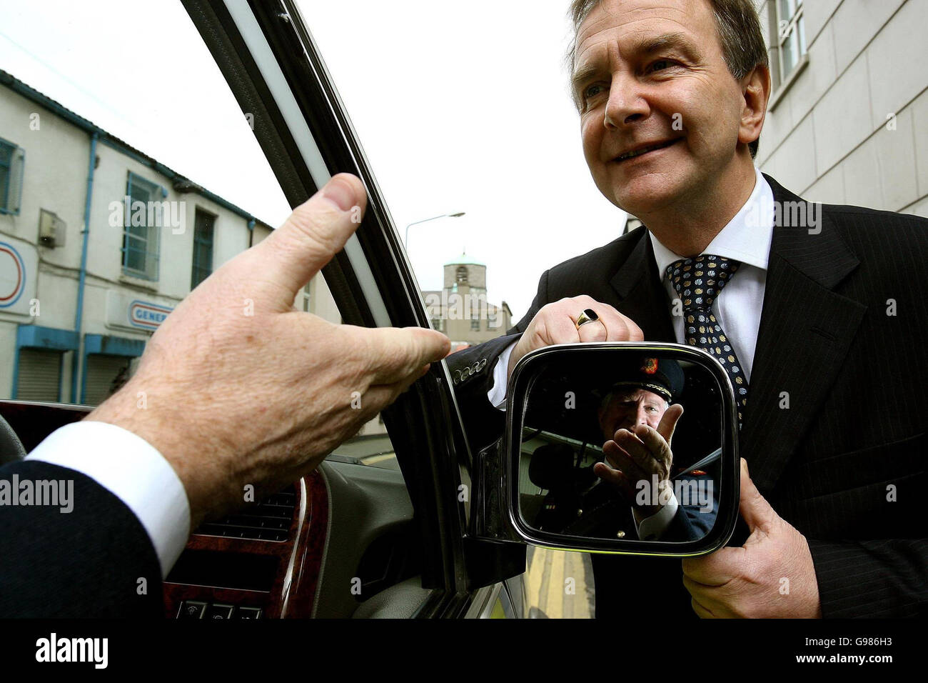 Minister for Transport Martin Cullen TD (right) with Deputy Garda Commissioner Fachtna Murphy (pictured in the side mirror of a Garda Jeep) at the launch of the new public information campaign to highlight the extension and computerisation of the penalty-points system, at the Alexander Hotel in Dublin, Thursday March 30, 2006. A total of 35 different driving offences can now put penalty points on your licence it was announced today. See PA story TRANPORT Penalties Ireland. PRESS ASSOCIATION Photo. Photo credit should read: Julien Behal/PA Stock Photo