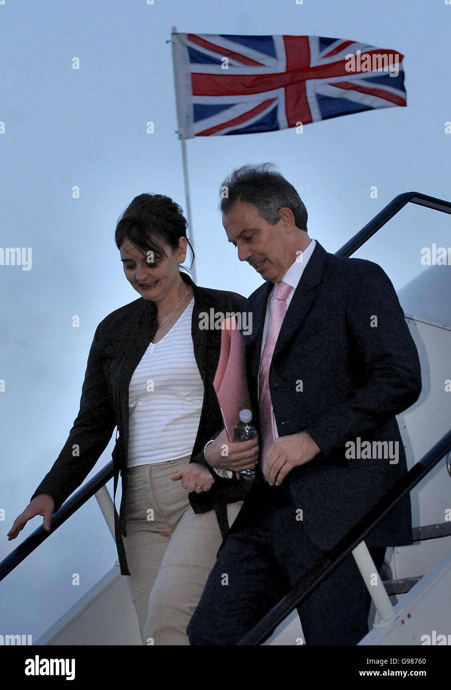 British Prime Minister Tony Blair and his wife Cherie arrive back at