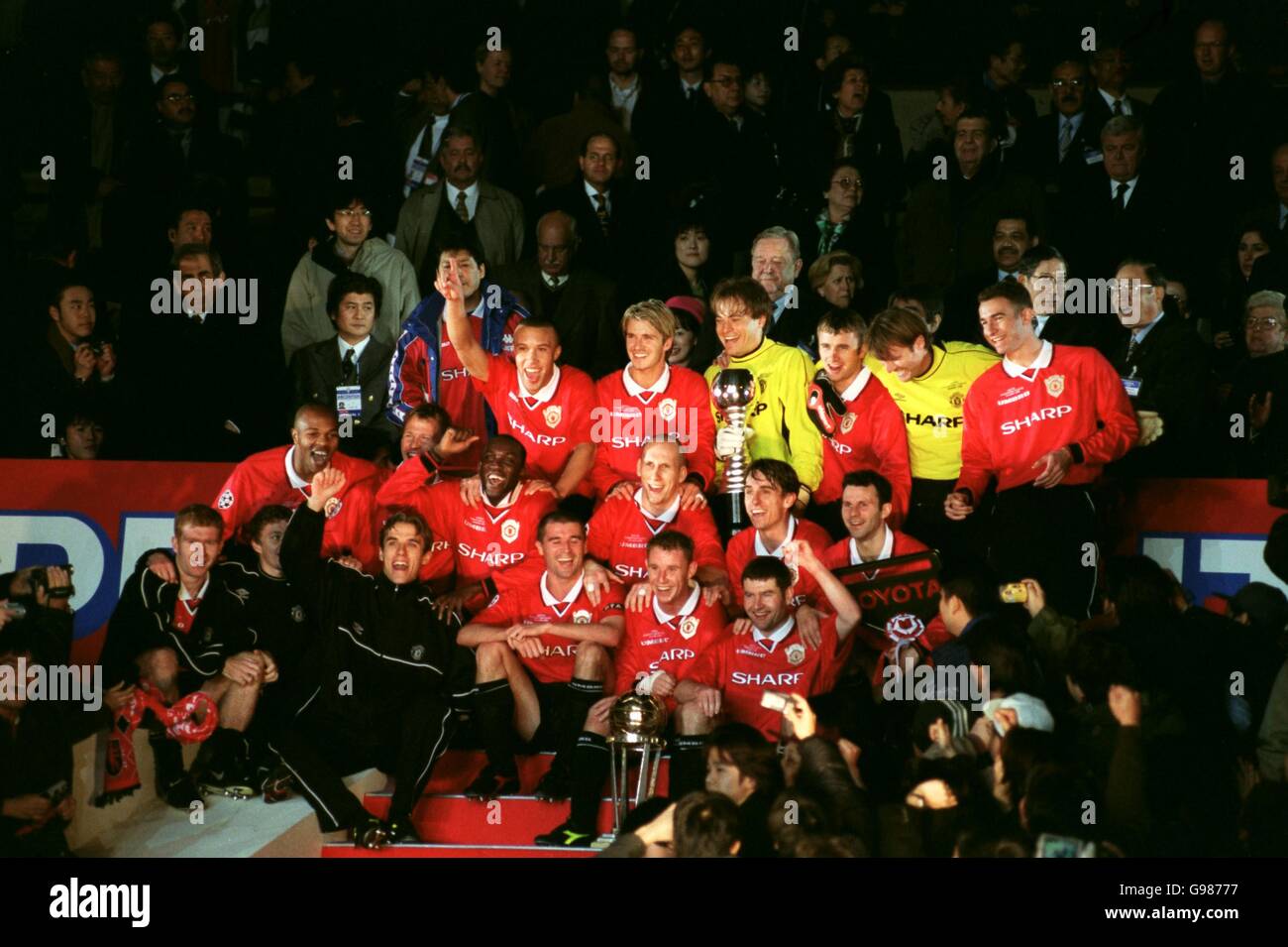 Manchester United lift the Toyota Cup trophy after defeating