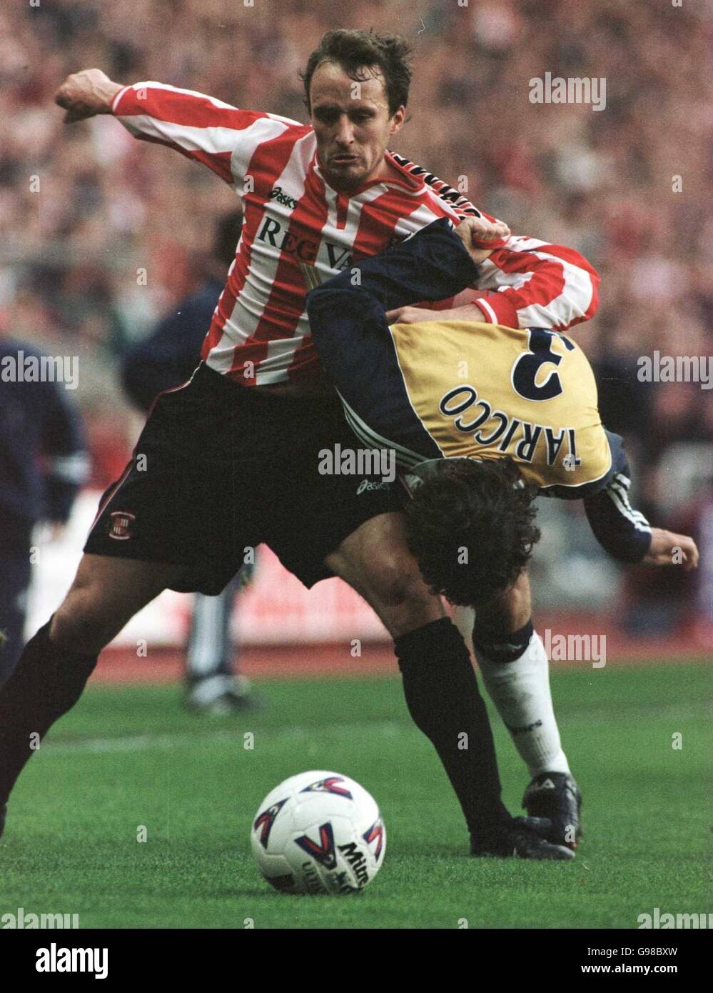 Sunderland's Nicky Sumerbee battles for the ball with Tottenham Hotspur's Mauricio Taricco Stock Photo