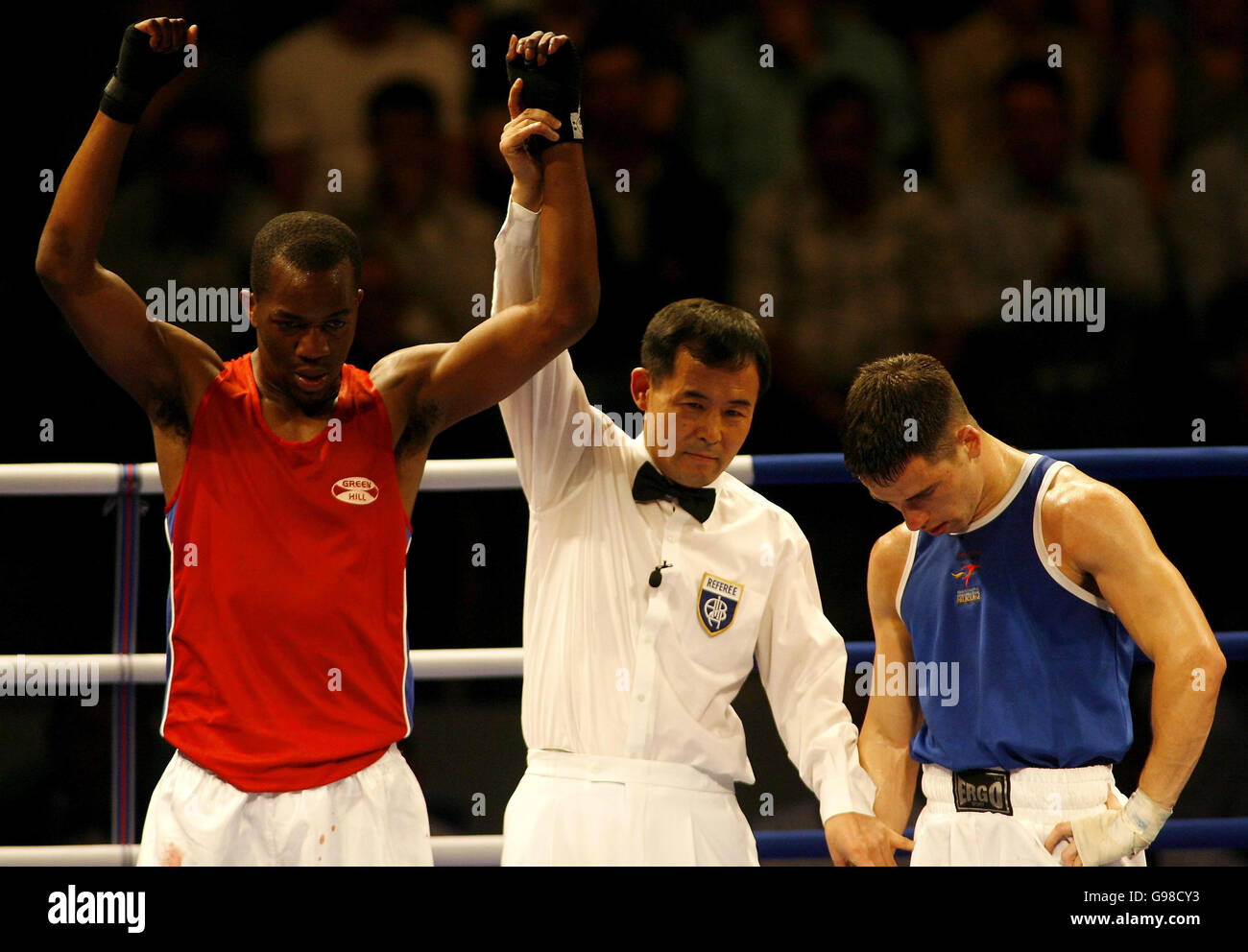 Aaron Thomas of Wales (r) hangs his head after losing to Malawi's Fundo Chifundo Mhura during their Welterweight Bout at the Melbourne Exhibition Centre, during the 18th Commonwealth Games in Melbourne, Australia, Friday 17th March, 2006. PRESS ASSOCIATION Photo. Photo credit should read: Gareth Copley/PA. Stock Photo
