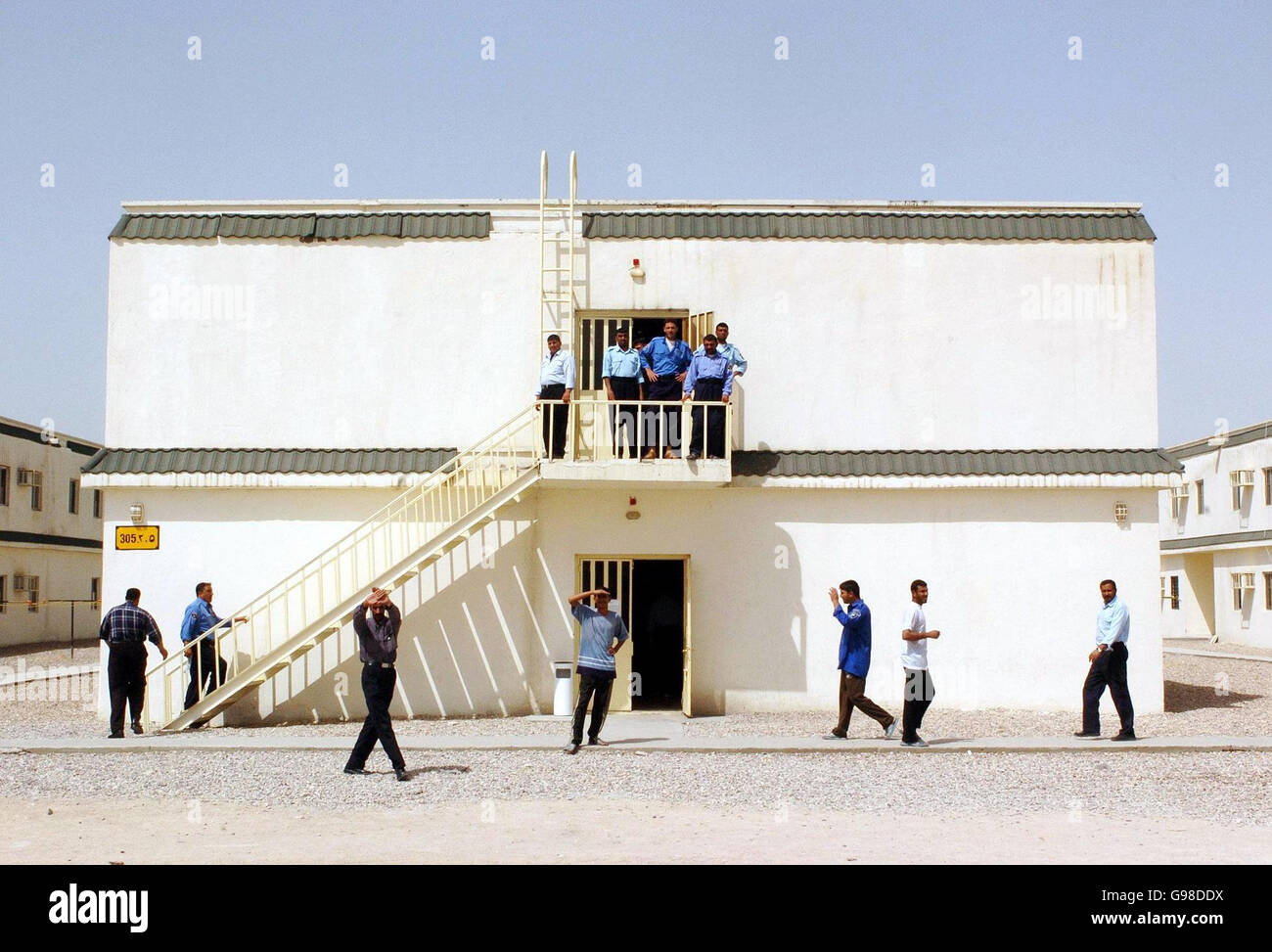 Iraqi police cadets and serving officers wait for afternoon classes to begin at a Joint Training Academy close to Shaibah Logistics Base (SLB) near Basra, southern Iraq, Saturday March 18, 2006. A combination of British army and police are currently training the Iraqi Police Force at various academies and training centres in the south of country. See PA story DEFENCE Iraq. PRESS ASSOCIATION photo. Photo Credit should read : Johnny Green/PA. Stock Photo