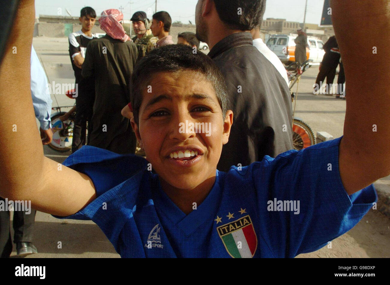 An Iraqi boy sports an Italian national football shirt on the outskirts of Az Zubayr, southern Iraq, Saturday March 18, 2006. As the third anniversary of the invasion of Iraq approaches, mixed sentiments of the ongoing presence of coaltion forces are still visible, with some openly welcoming while others are not. See PA story DEFENCE Iraq. PRESS ASSOCIATION Photo. Photo credit should read: Johnny Green/PA. Stock Photo