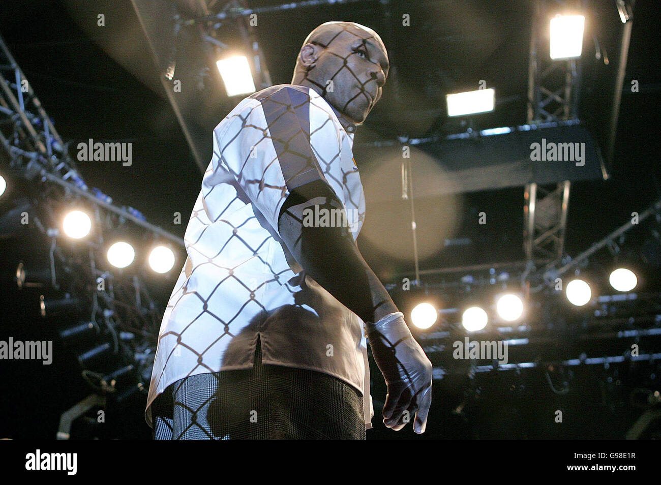 Former heavyweight boxer Mike Tyson referee's a match during the World Cage Fighting