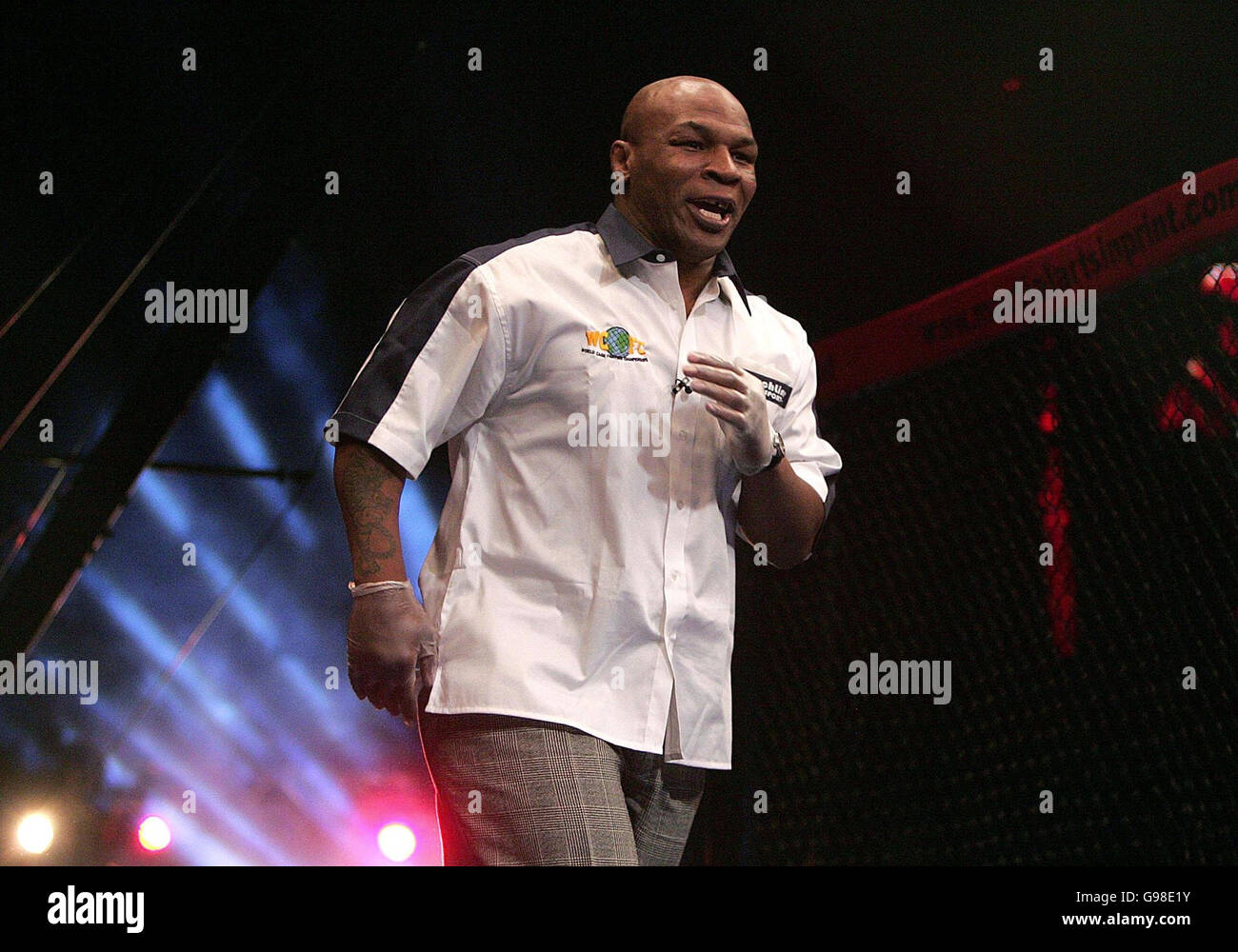 Former heavyweight boxer Mike Tyson referee's a match during the World Cage Fighting