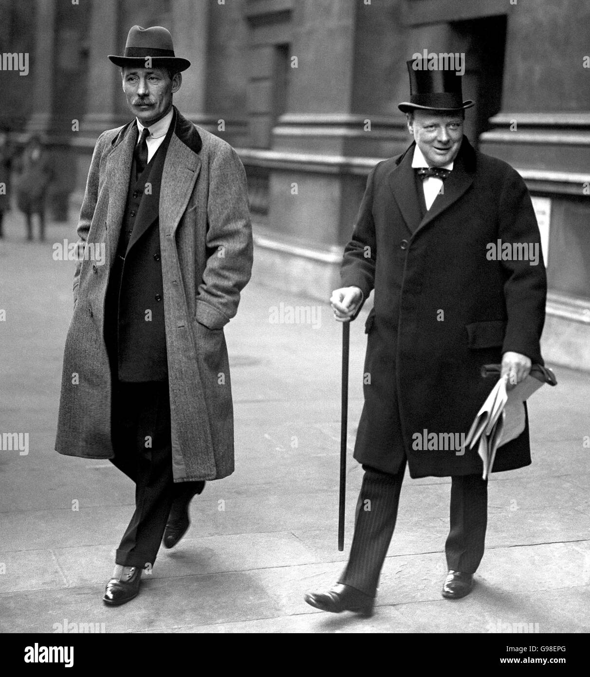 Winston Churchill, right, back in London after his trip to Egypt, leaving the Colonial Office with Captain Rt Hon Sir Frederick Guest. Stock Photo