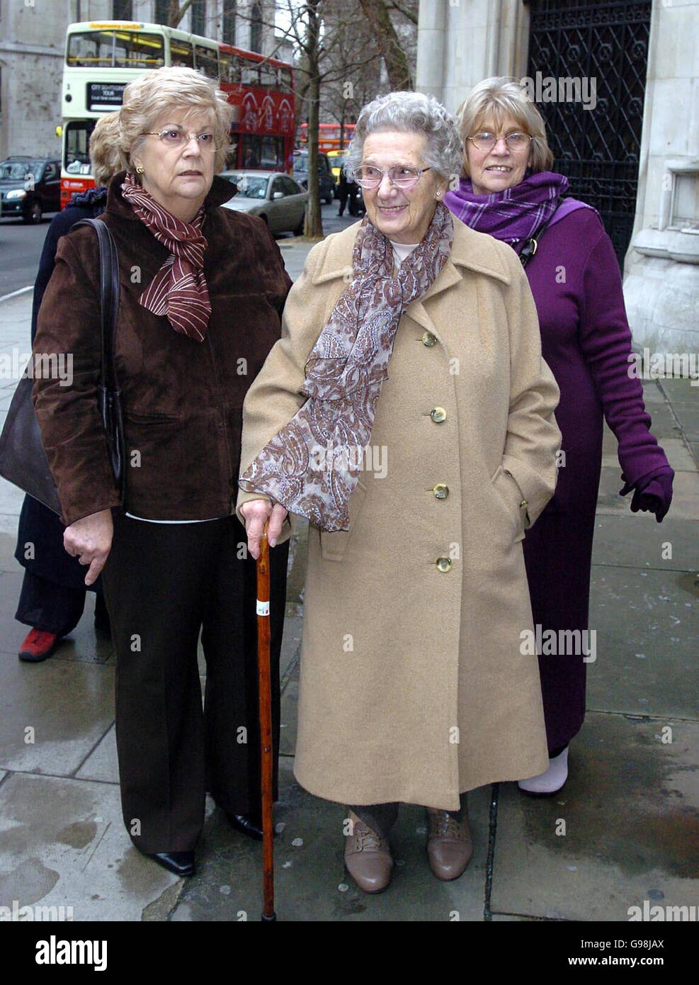 Gertrude Harris(centre), 92, the daughter of First World War soldier Harry Farr who was shot for cowardice, arrives at the High Court in London with her daughters Janet Booth (left) and Valerie Jackson, Monday 27 March 2006. The family is asking the High Court to overturn a Governmemt decision refusing him a posthumous pardon. Monday 27 March 2006. See PA Story COURTS Soldier. PRESS ASSOCIATION PHOTO. Photo credit should read: Michael Stephens/PA Stock Photo