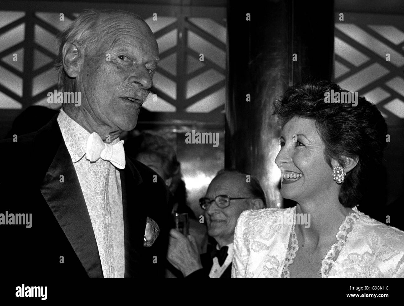 Norman Parkinson draws a smile from television presenter Sue Lawley at a gala dinner. Stock Photo