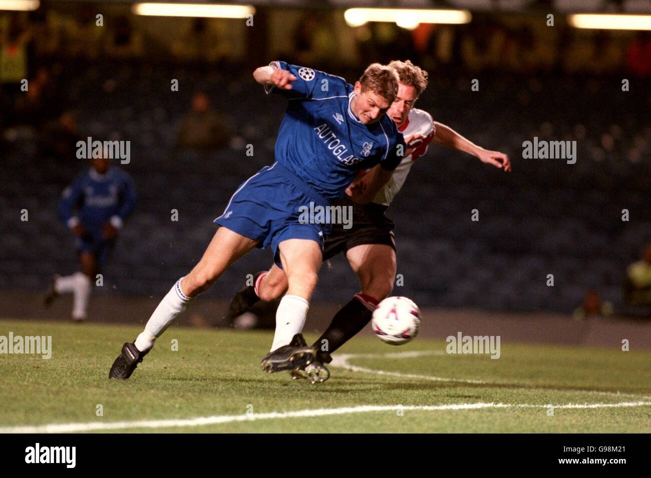 Chelsea's Tore Andre Flo (left) tries to turn Feyenoord's Bert ...