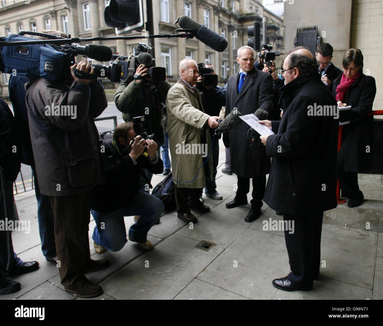 Graham Sankey's Solicitor David Kirwan reads a statement to the waiting media outside Liverpool Magistrates Court, Thursday March 9 2006 where he faced a banning order preventing him travelling to the World Cup in Germany. Sankey confessed to a crime for which a British teenager is serving 15 years in a Bulgarian prison and appeared in court today facing a ban from all football matches in the UK and abroad. Graham Sankey, 20, from Liverpool, made a written confession to throwing a brick at a Bulgarian man during a fight in the Golden Sands resort, in Varna, in May, last year. See PA story Stock Photo