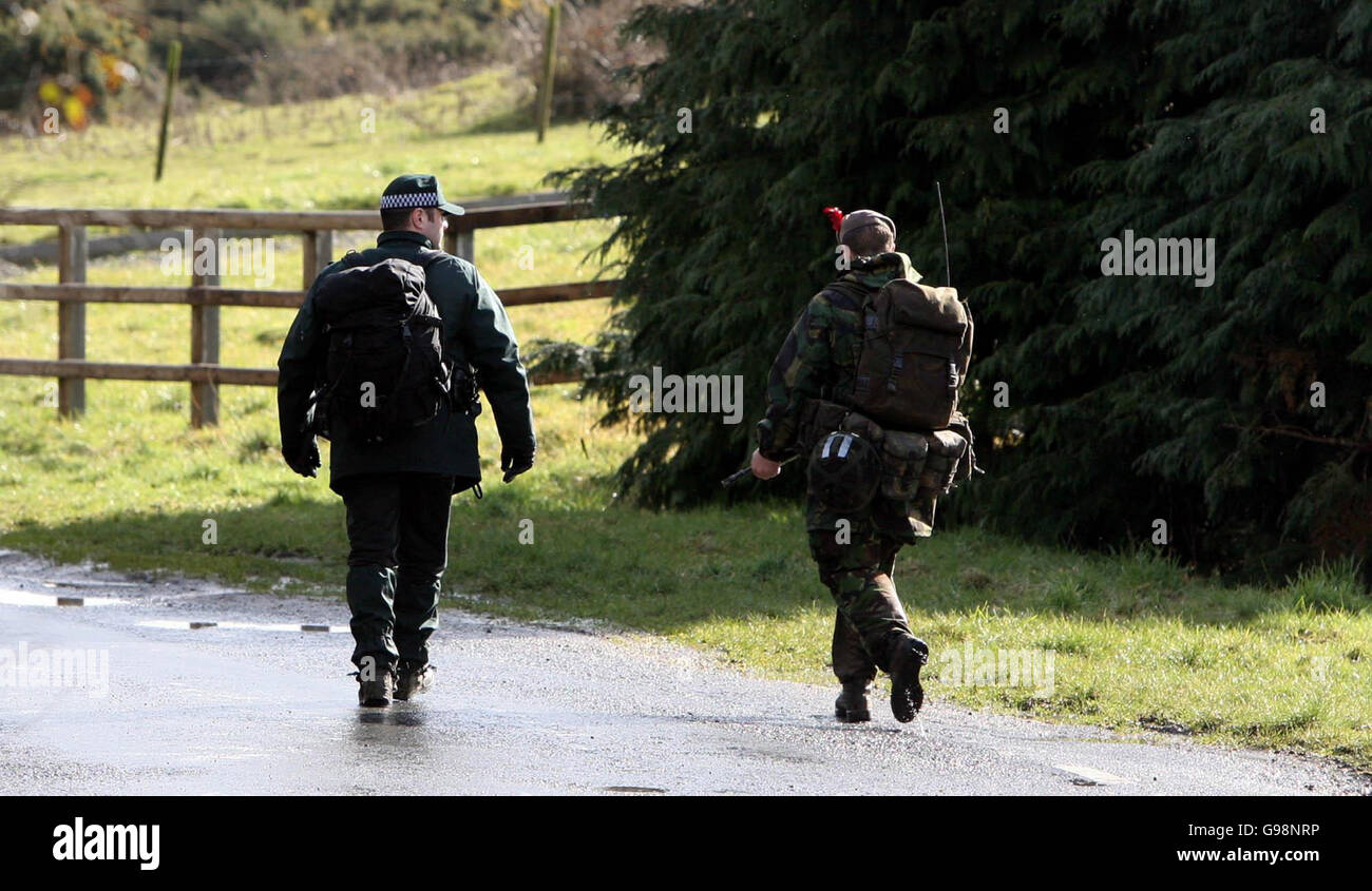 PSNI officers and British Army jointly patrol the scene of a major cross border search operation Near Crossmaglen in Co Armagh, Thursday March 9 2006. Three people were arrested during a massive security operation linked to a major investigation into organised crime on both sides of the Irish border today. Hundreds of police and soldiers in south Armagh and north Co Louth raided properties and at one stage an area around the family home of Thomas 'Slab' Murphy, 62, allegedly the IRA's one-time Chief of Staff, was sealed off. PRESS ASSOCIATION Photo. Photo credit should read: Niall Carson/PA Stock Photo