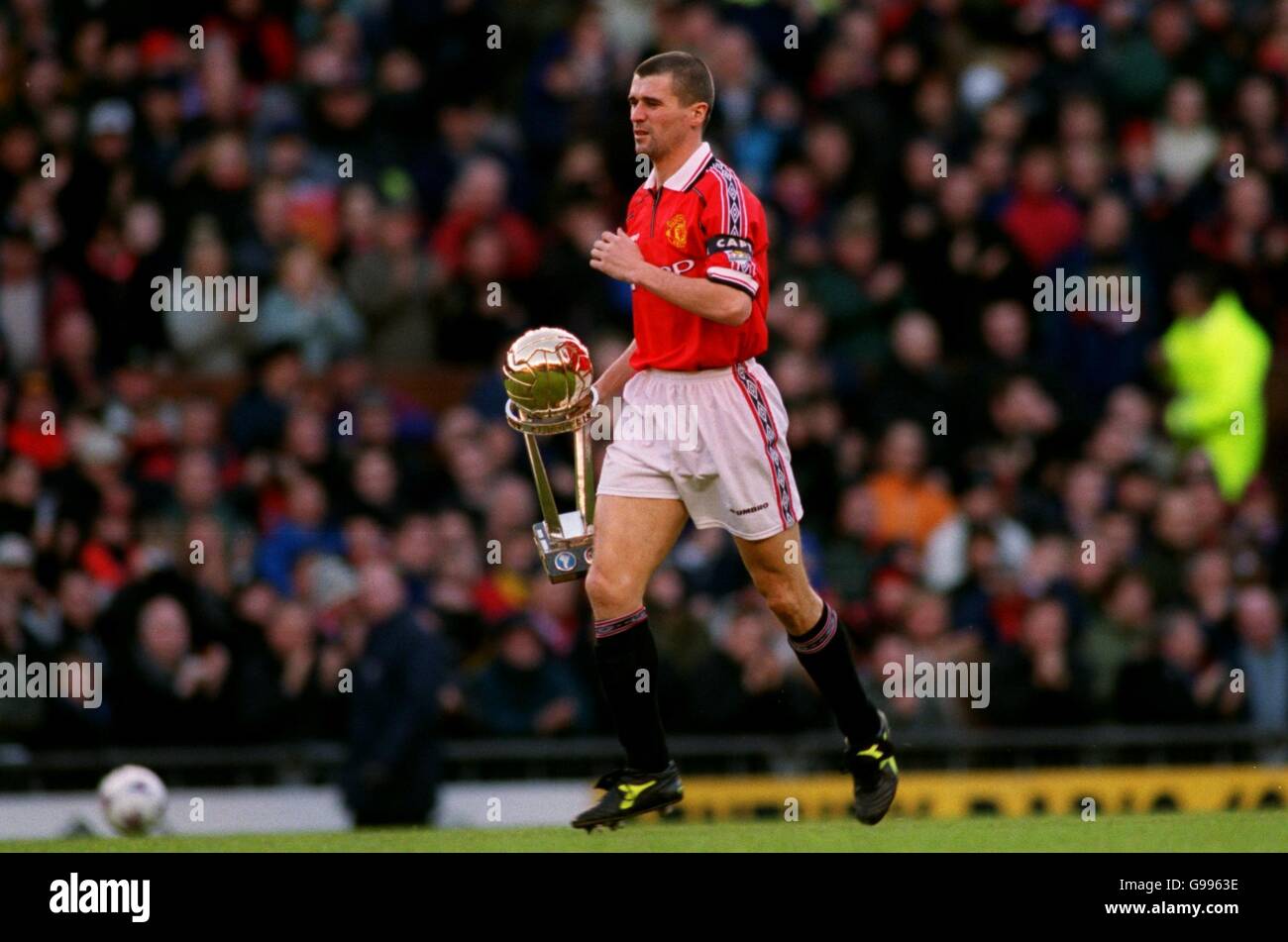 Manchester United's Captain Roy Keane walks out onto the field with the