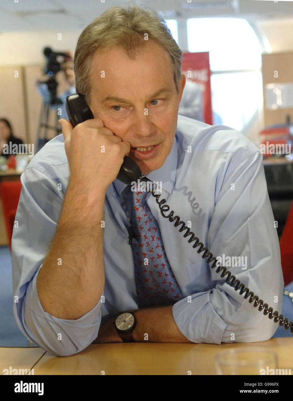 Britain's Prime Minister Tony Blair speaks on the phone canvassing voters at the Labour Party's forthcoming local election headquarters in central London. Stock Photo
