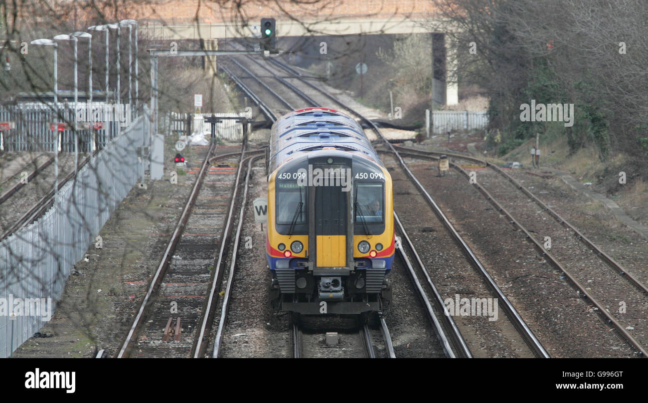 A South West Trains Class 450 'Desiro' Electric train on the line between London and Staines. Stock Photo