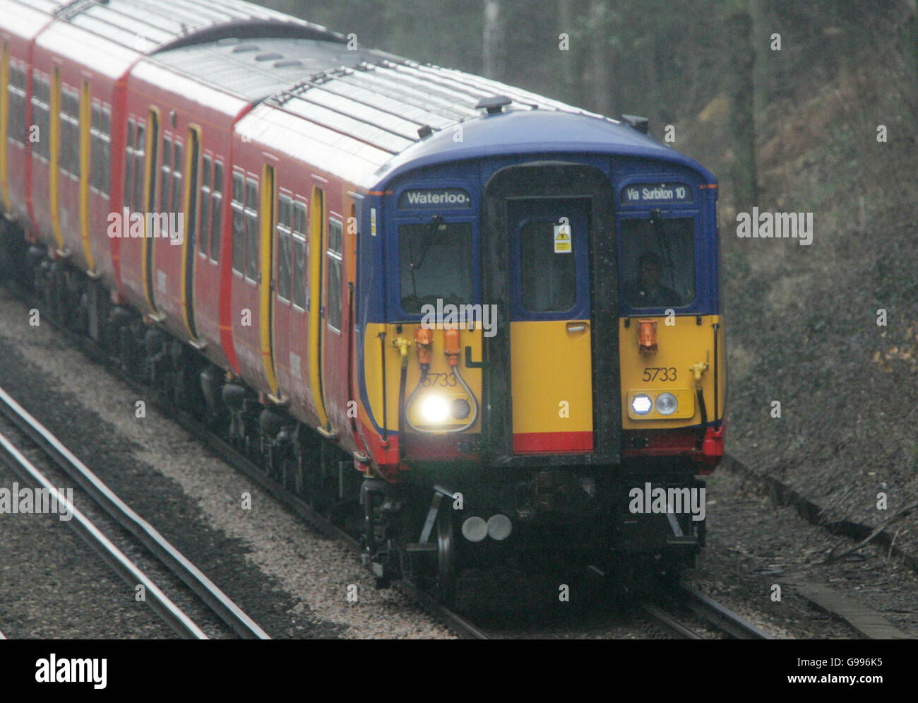 A South West Trains Class 455 Electric train on the line between Waterloo and Woking. Stock Photo