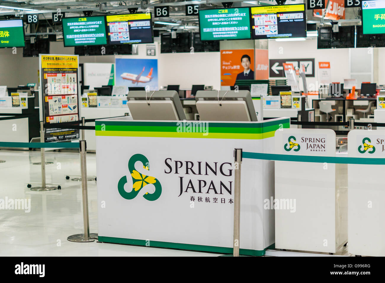 Spring Airline check-in counter at Narita airport, Japan Stock Photo