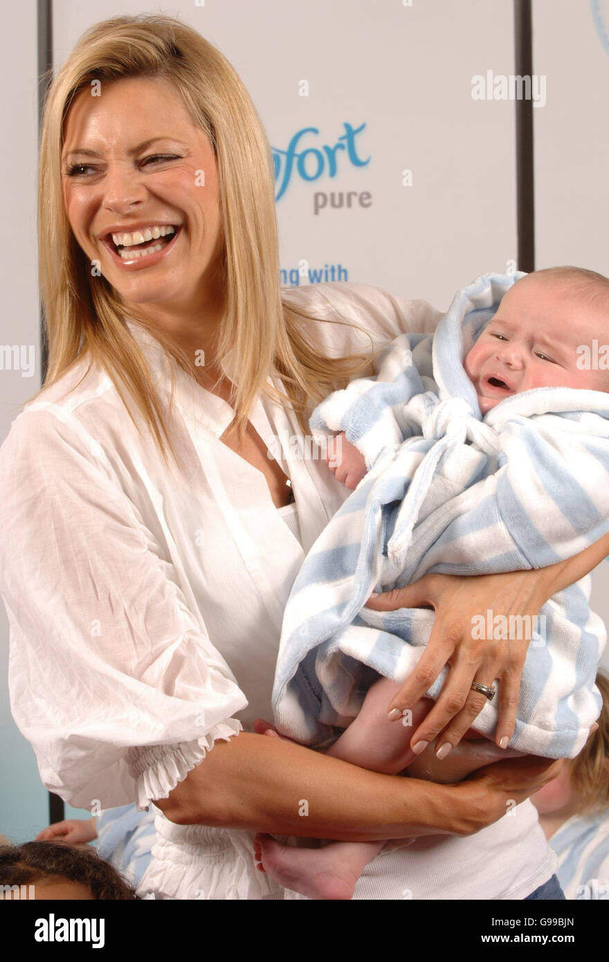 Tess Daly with Cayden Reeves (aged 3mths, from Derbyshire) at the launch of a nationwide search for the softest, most comfortable but still durable baby clothes at 10 Cabot Square, Canary Wharf, east London. Stock Photo